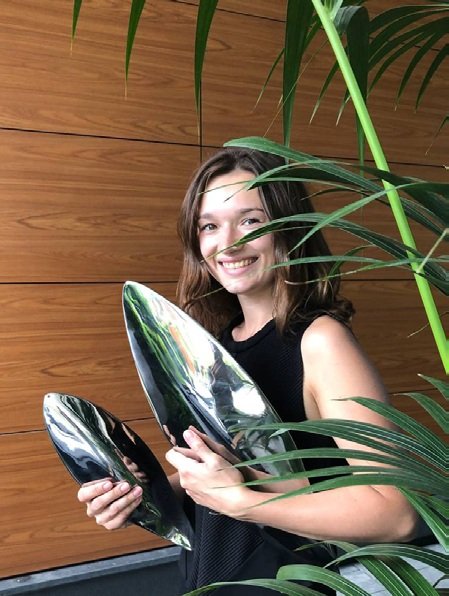 Alexandra Toropova with her steel fish sculptures at Kandinsky House